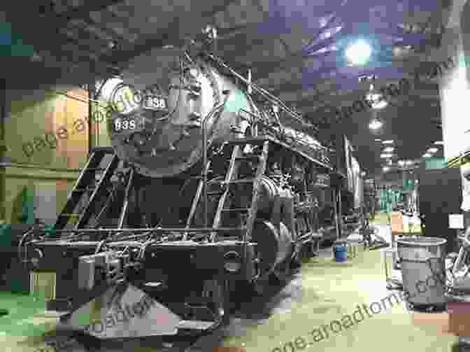 A Photograph Of A Restored Steam Locomotive On Display In A Museum, Surrounded By Vintage Train Cars. American Locomotives In Historic Photographs: 1858 To 1949 (Dover Transportation)