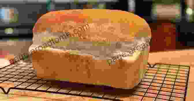 Golden Brown Loaf Of Freshly Baked Bread, Sliced And Ready To Enjoy. The European Top 20 Baking Recipes: Easy To Imitate Easy To Bake Impress Everyone With Your Baking Talent